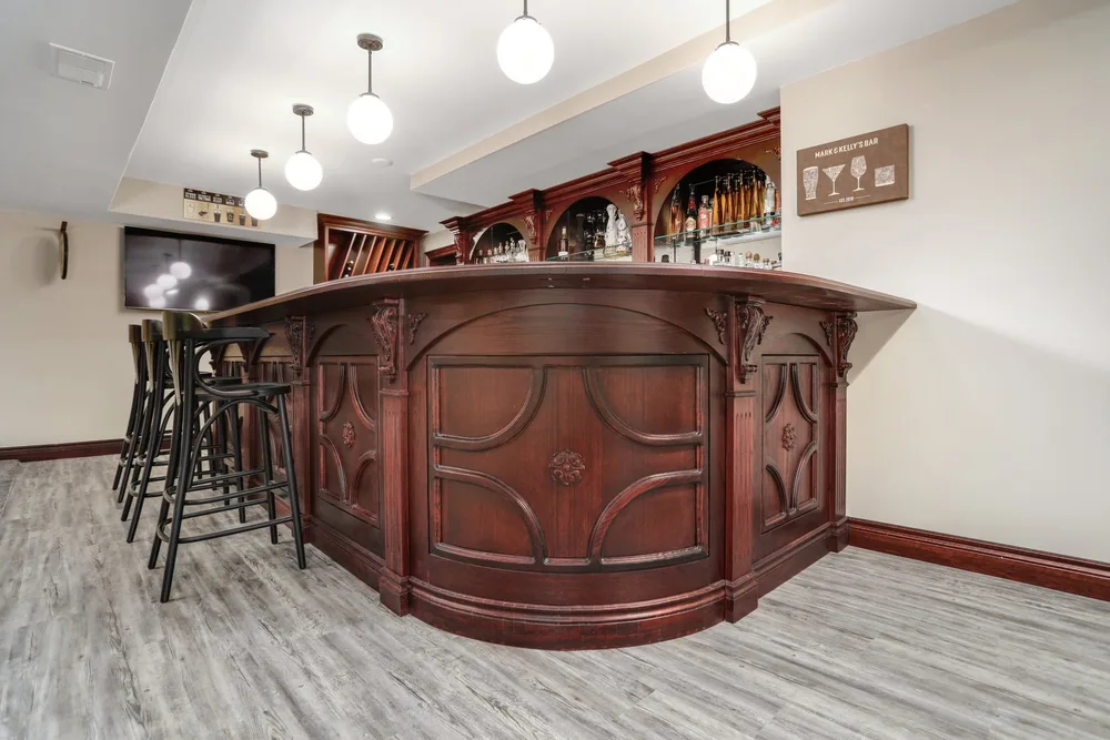 Custom bar and billiards room in Brighton, MI by Lux Builders