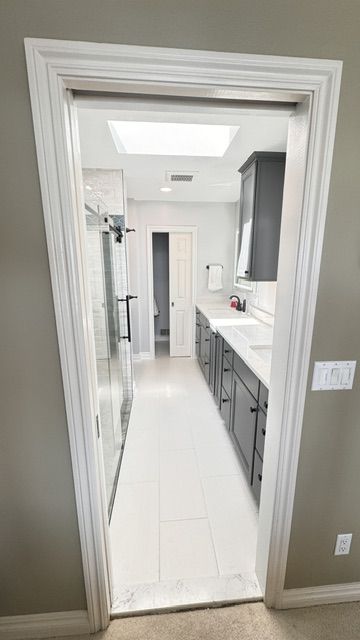 Walk-in shower with custom tile by Lux Builders